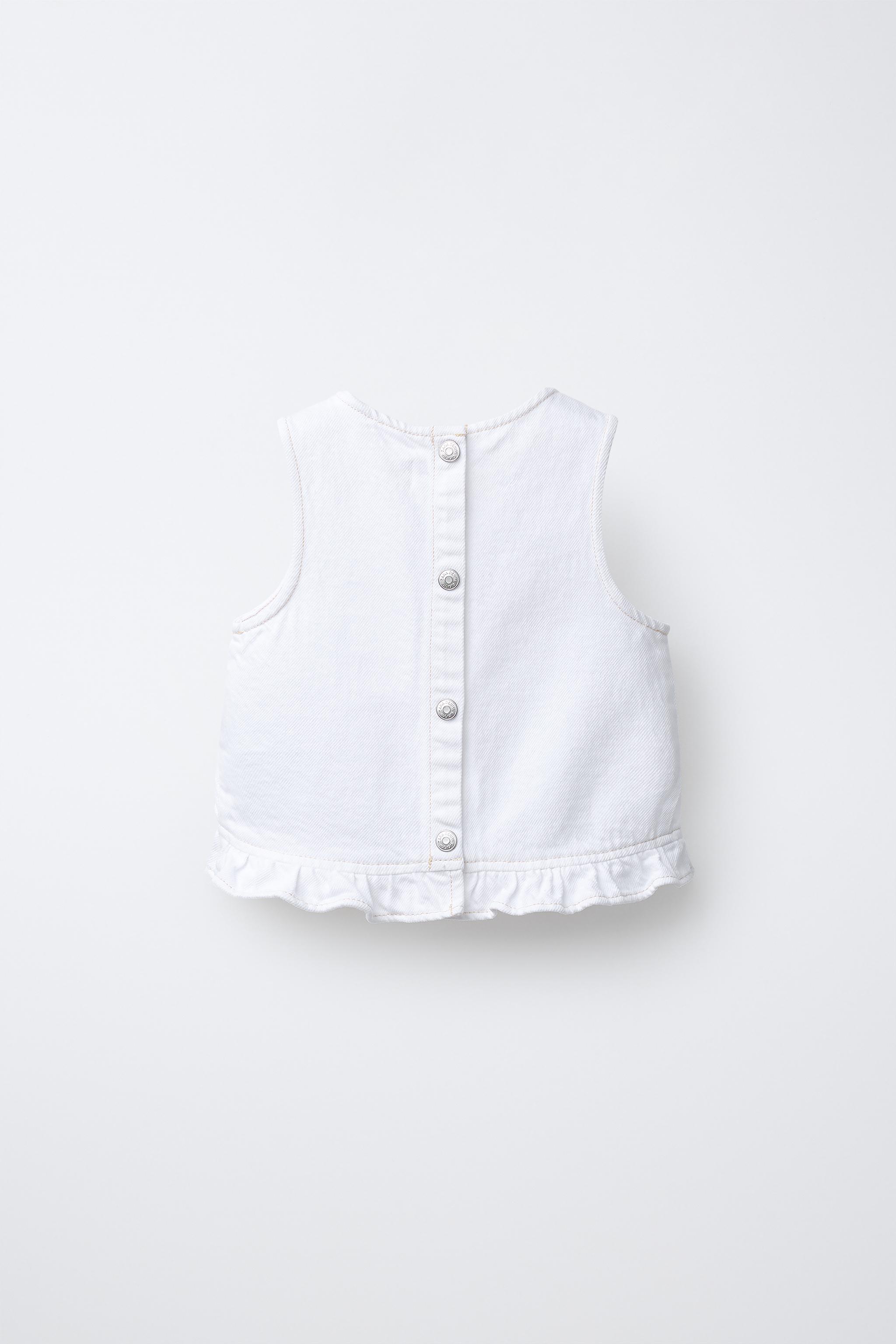 TOP EN DENIM À VOLANTS