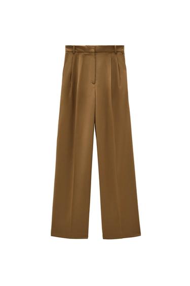 Brown wide-leg pleated pants with belt loops and a hidden closure, on a white background.