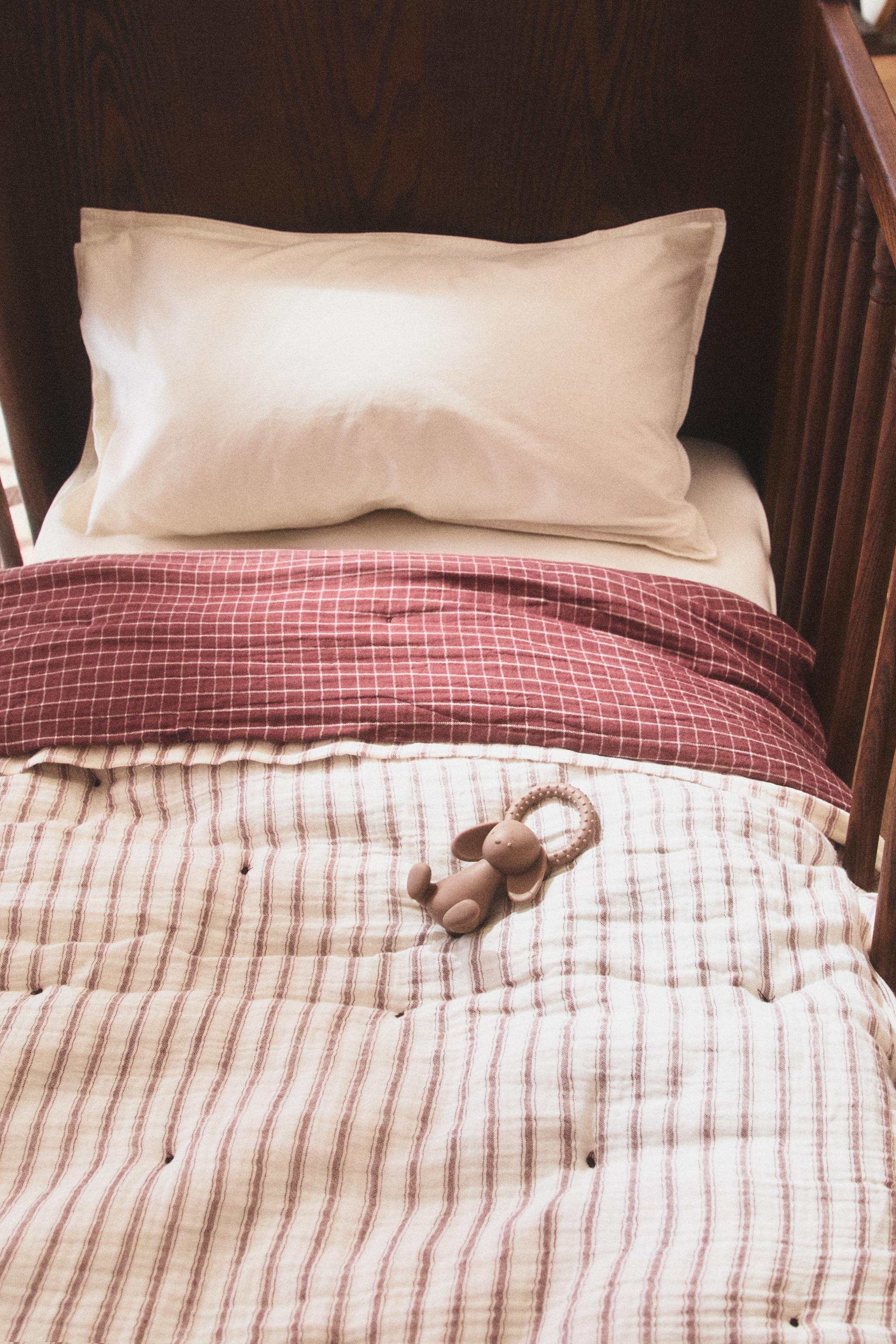 KIDS' REVERSIBLE CHECK AND STRIPE QUILT — Brown