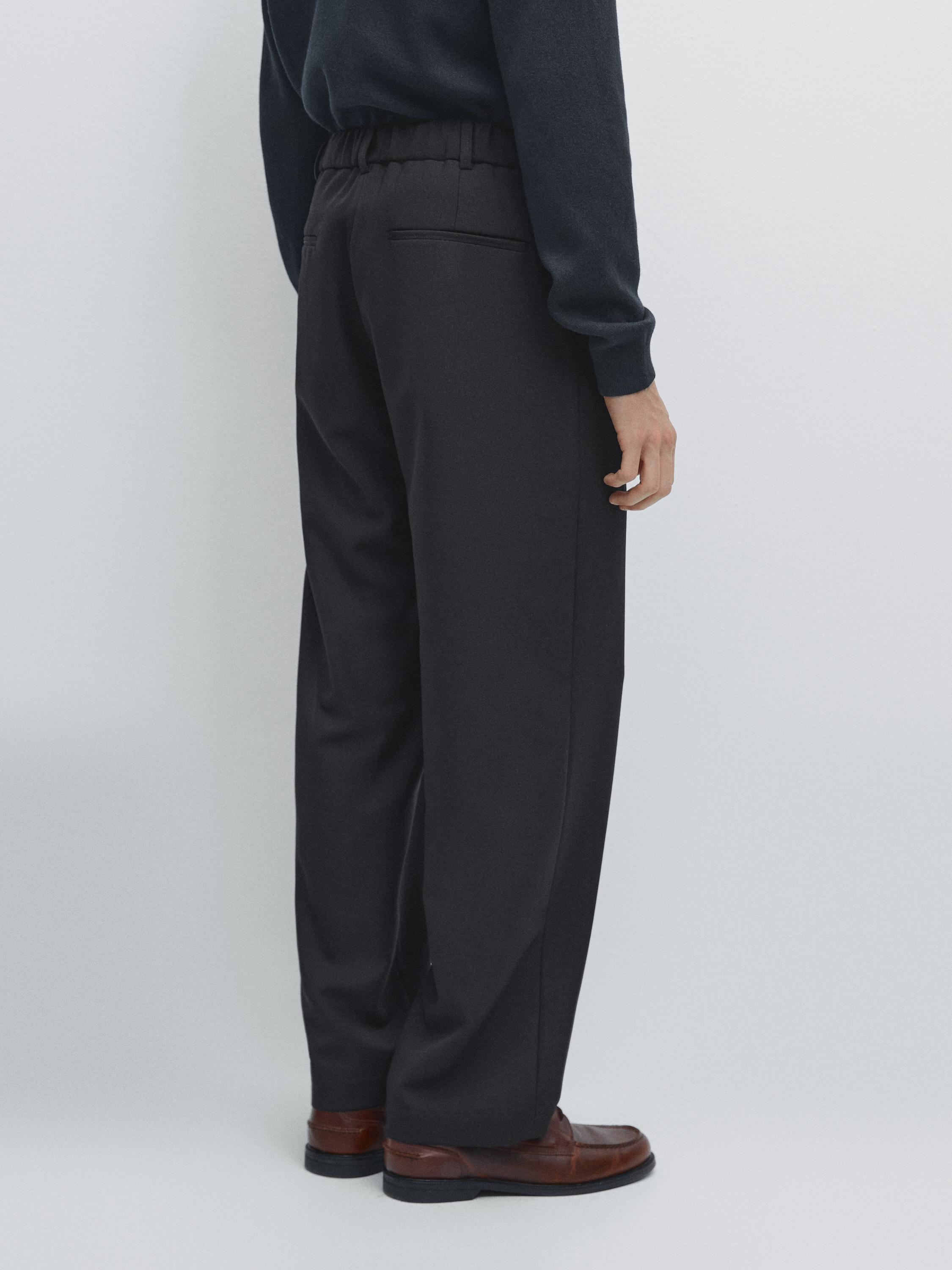 Relaxed fit darted wool blend trousers
