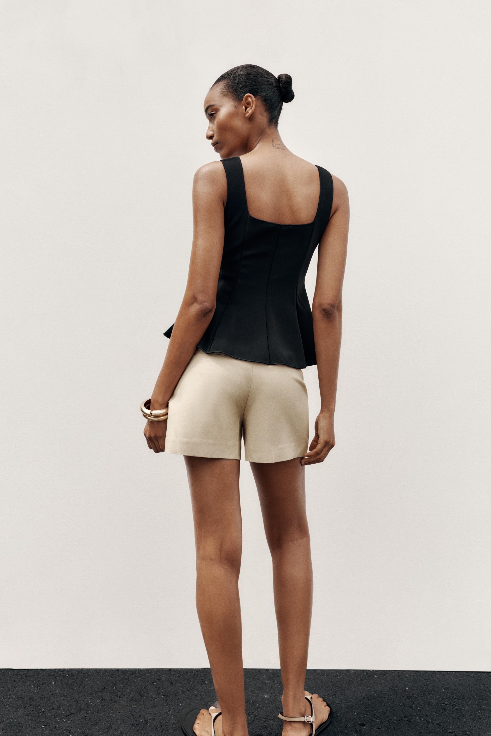 STRETCH PEPLUM VEST TOP