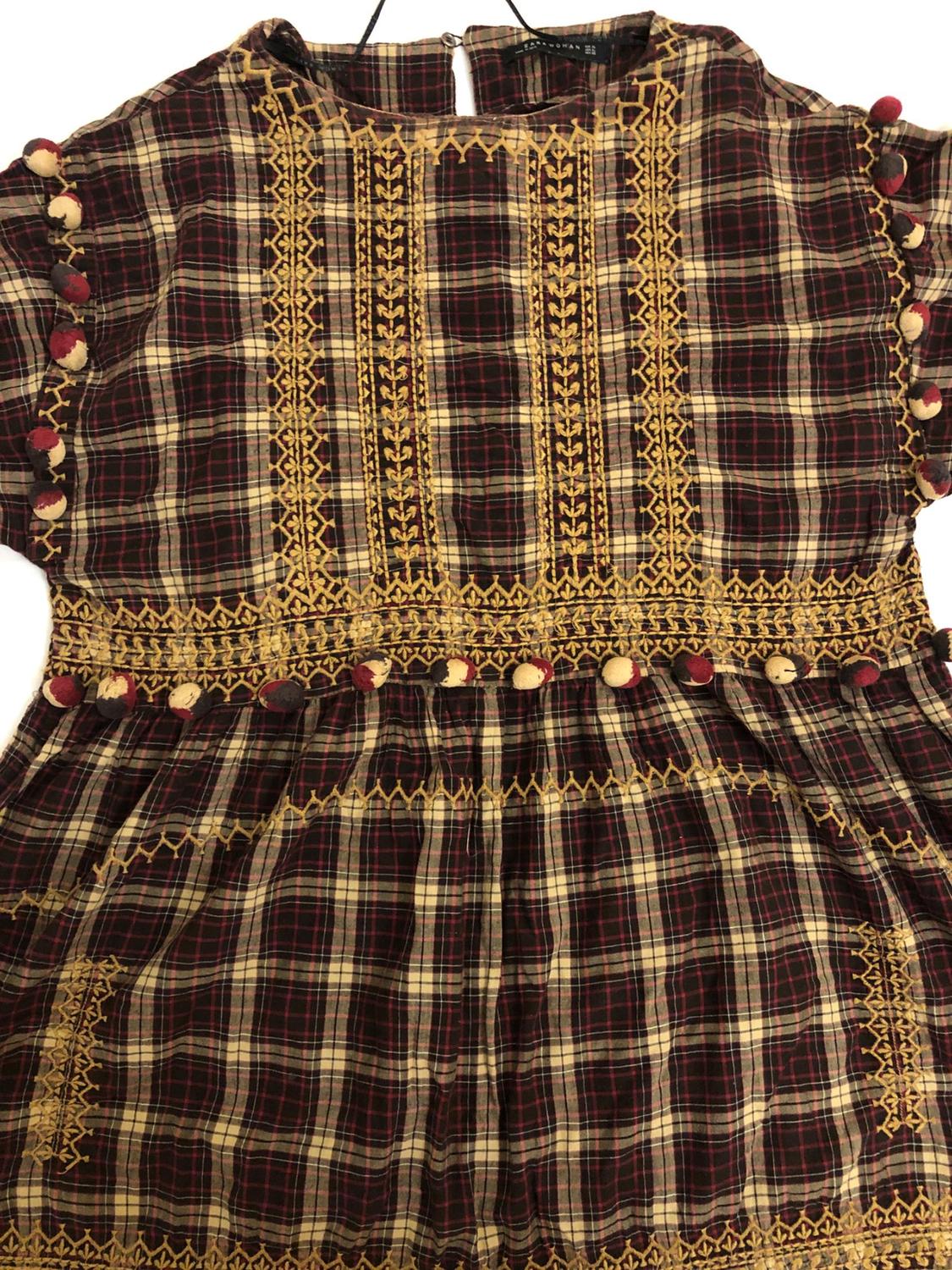 CHECKED DRESS WITH POMPOMS