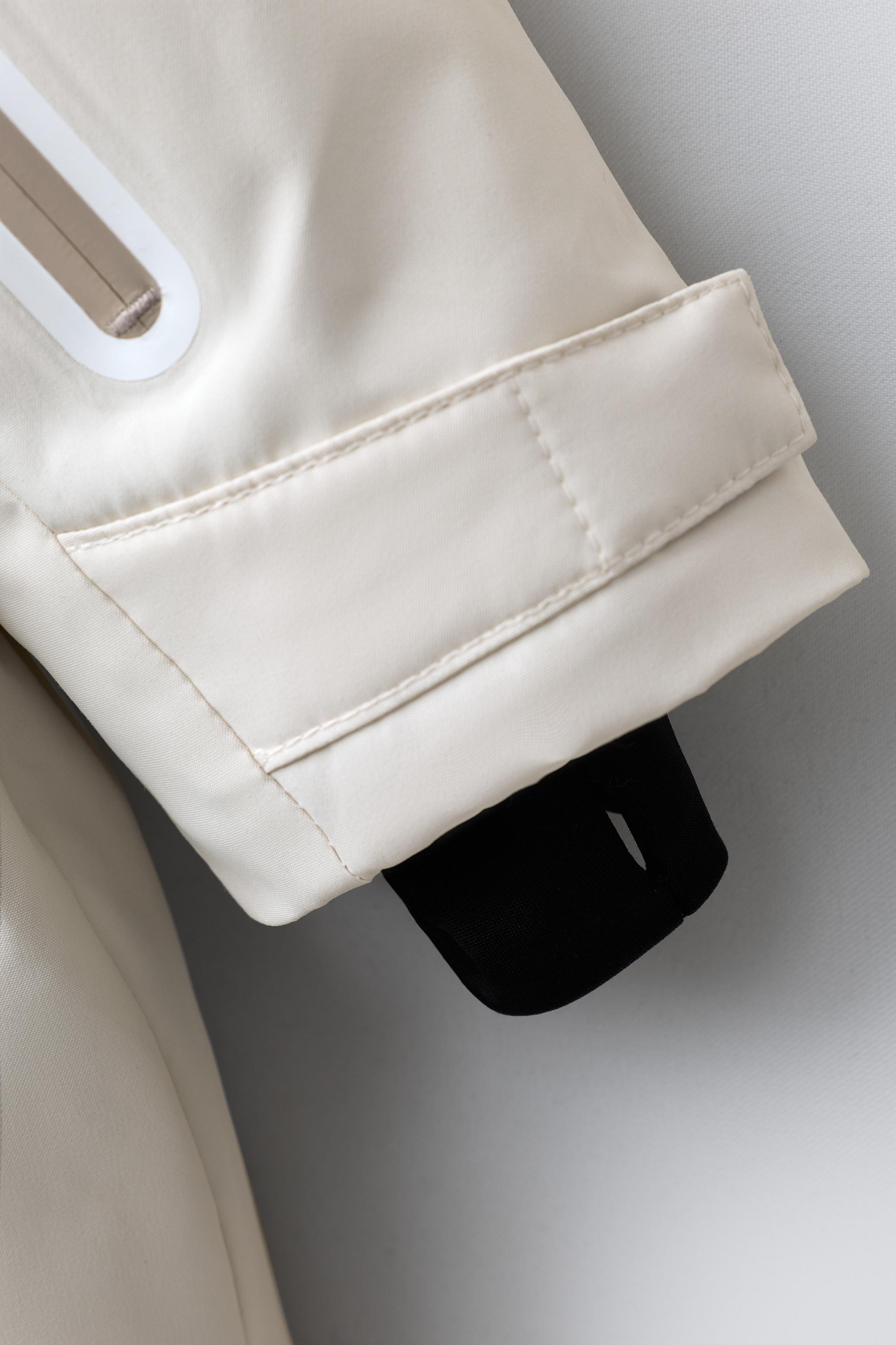 WATER RESISTANT AND WINDPROOF RECCO® SYSTEM SKI COLLECTION LONG JUMPSUIT WITH FAUX FUR HOODIE