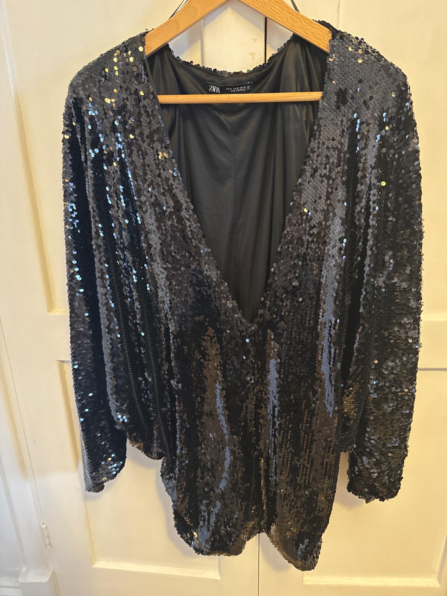 SEQUIN DRESS WITH A PLUNGING NECKLINE