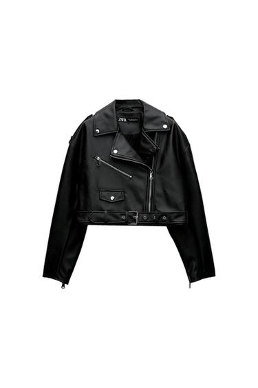 Black faux leather jacket with zips and belt. Short design with lapels and metal buttons. Visible label: Zara Woman.