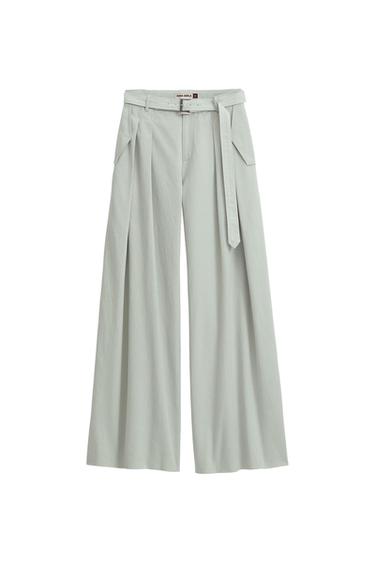 Light grey wide-leg trousers with matching belt and front pleats. Visible tag: "ZARA SRPLS".
