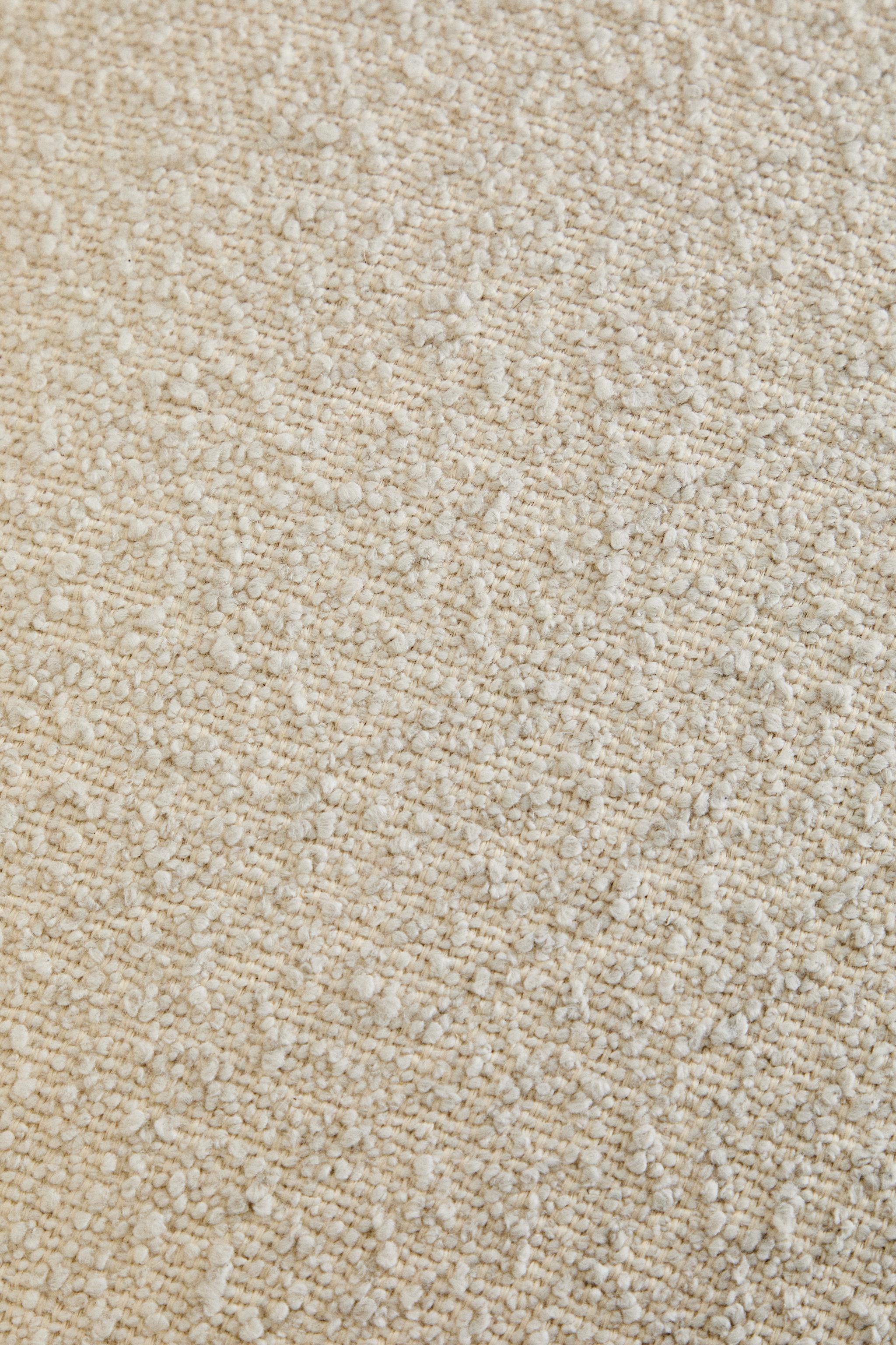FAUTEUIL TAPISSÉ BOUCLÉ