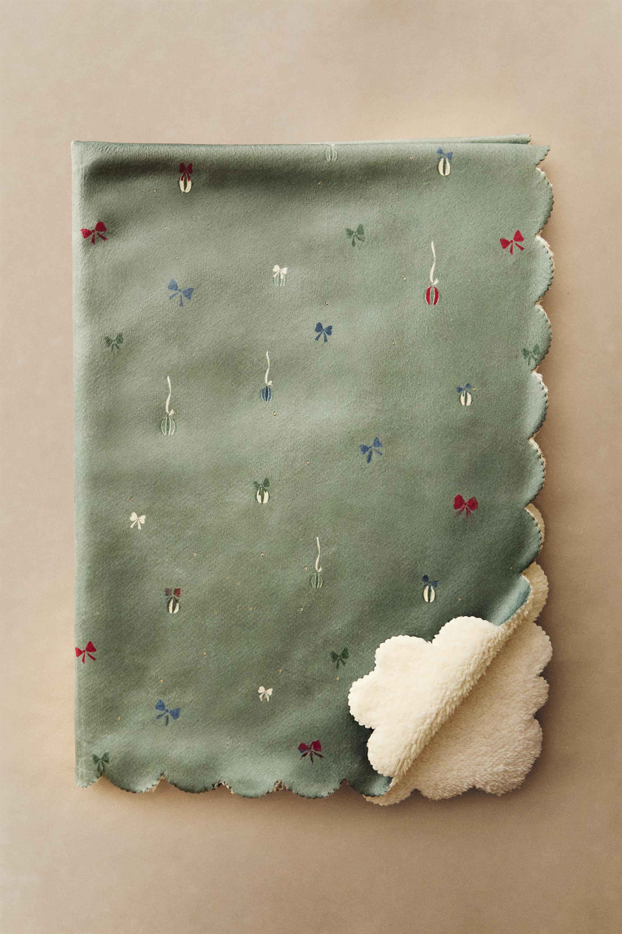 COUVERTURE ENFANT IMITATION MOUTON NOEUDS NOËL