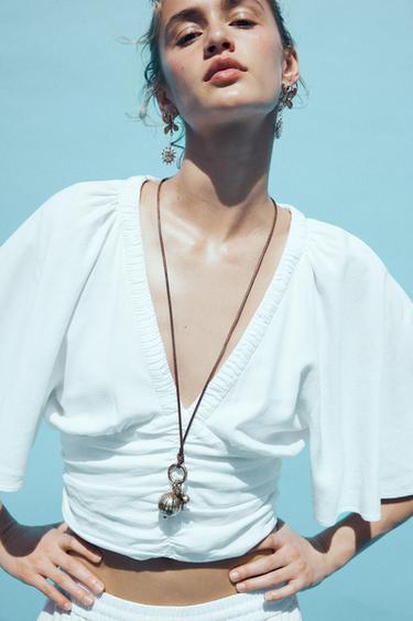 بلوزة بأكمام فريل بكتان - أبيض الخاص بـ Zara