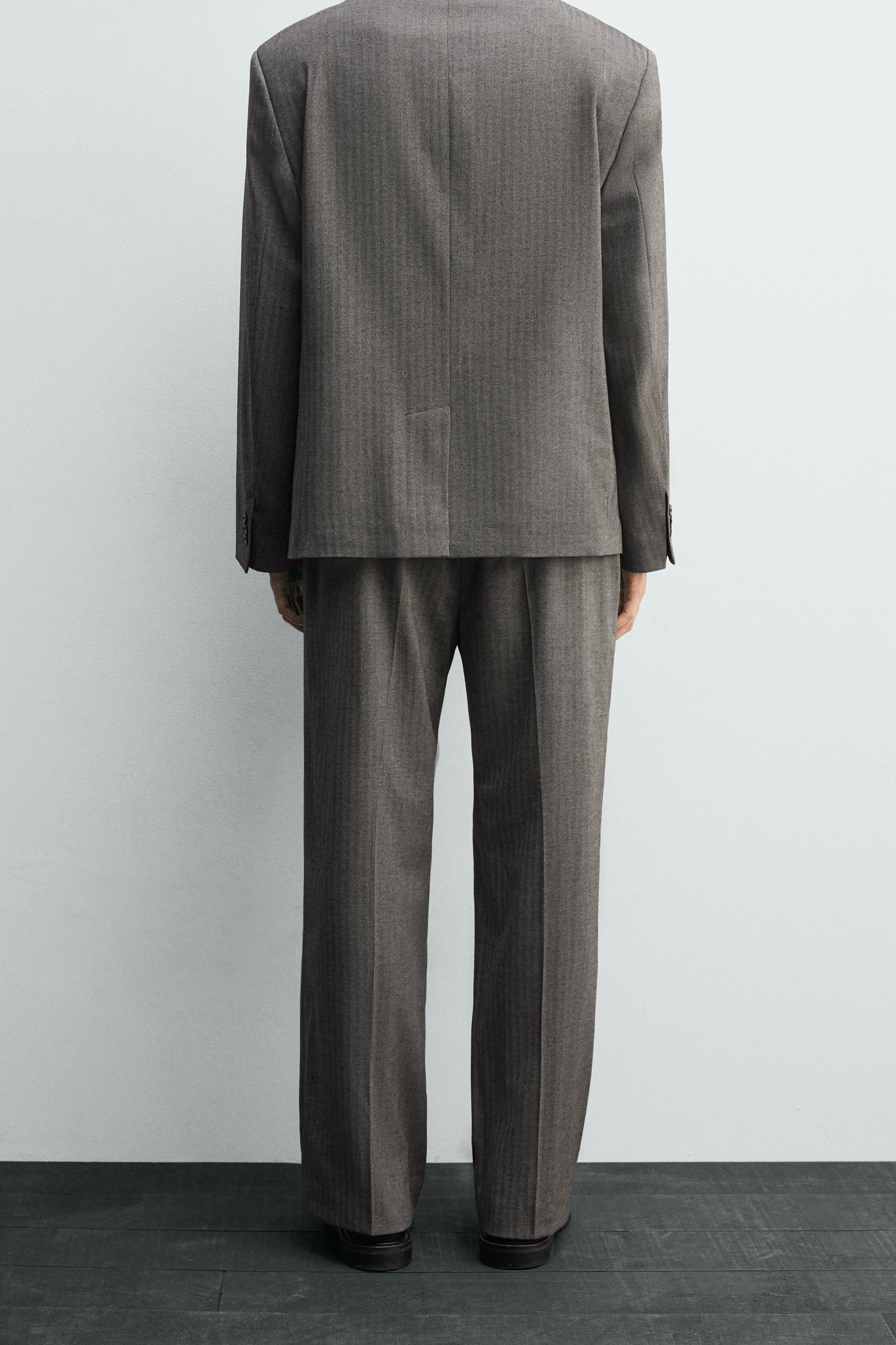 HERRINGBONE SUIT FLARE FIT PANTS