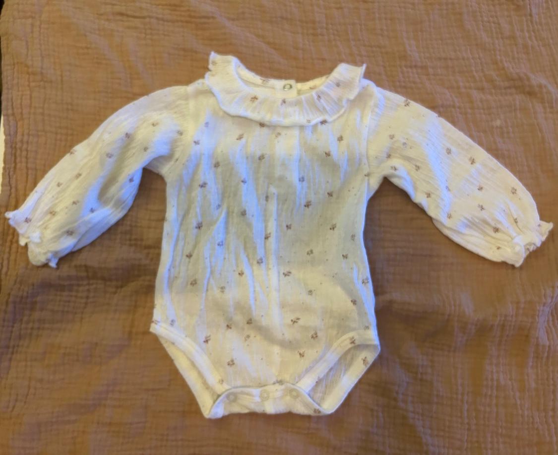 TEXTURED BODYSUIT WITH RUFFLE TRIM