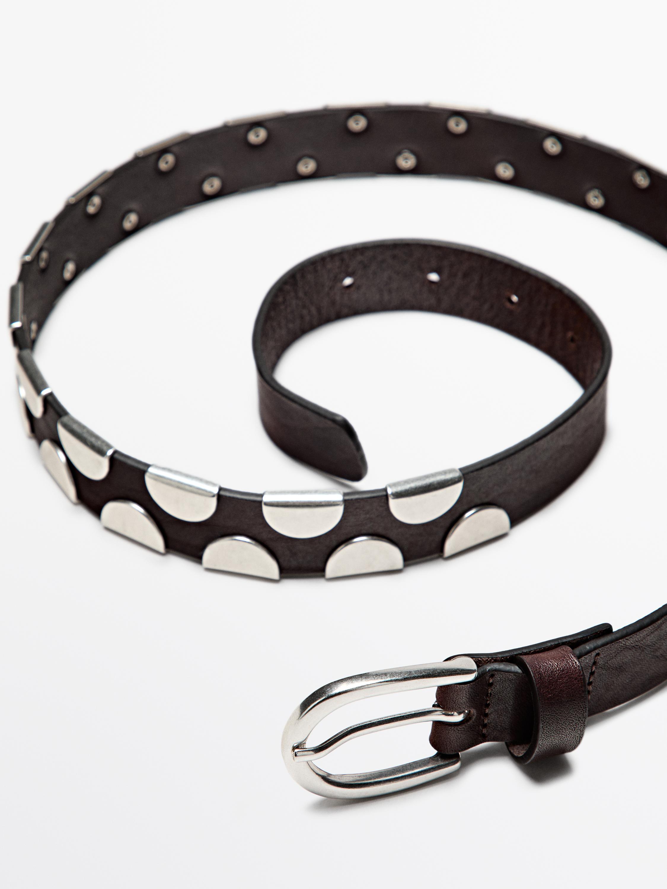 Belt with metal appliqués