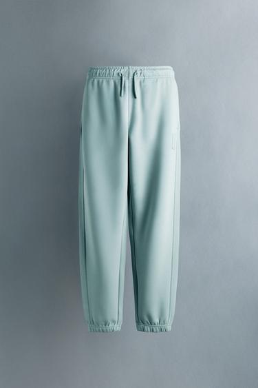 PANTALLONA JOGGER SPORTIVE ETIKETË E GOMUAR - Gri / Bojëqielle nga Zara