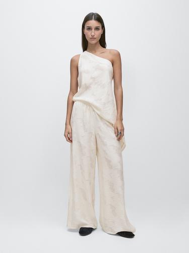 Pantalón goma fluido detalle tejido - Blanco de Zara - Imagen 0