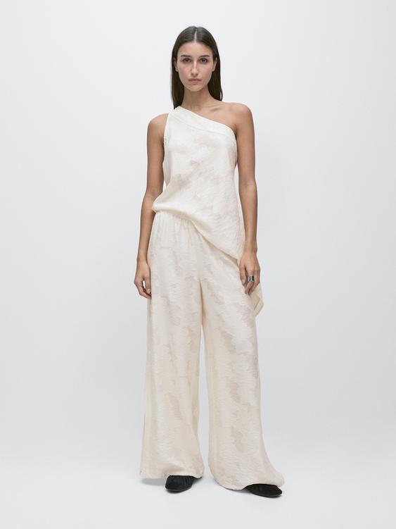 Flowing stretch trousers with fabric detail