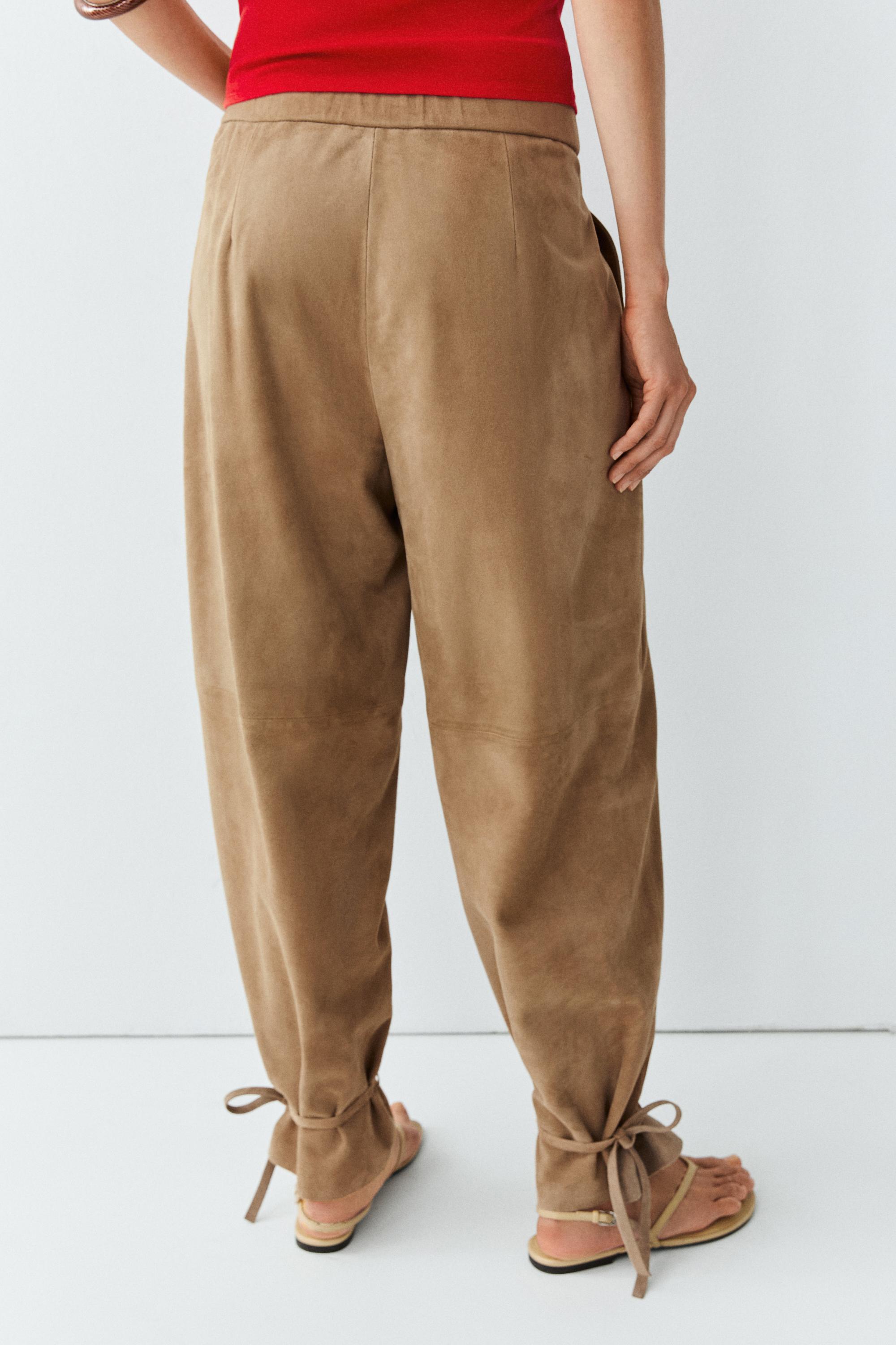 Suede leather pants with tie-detail hems