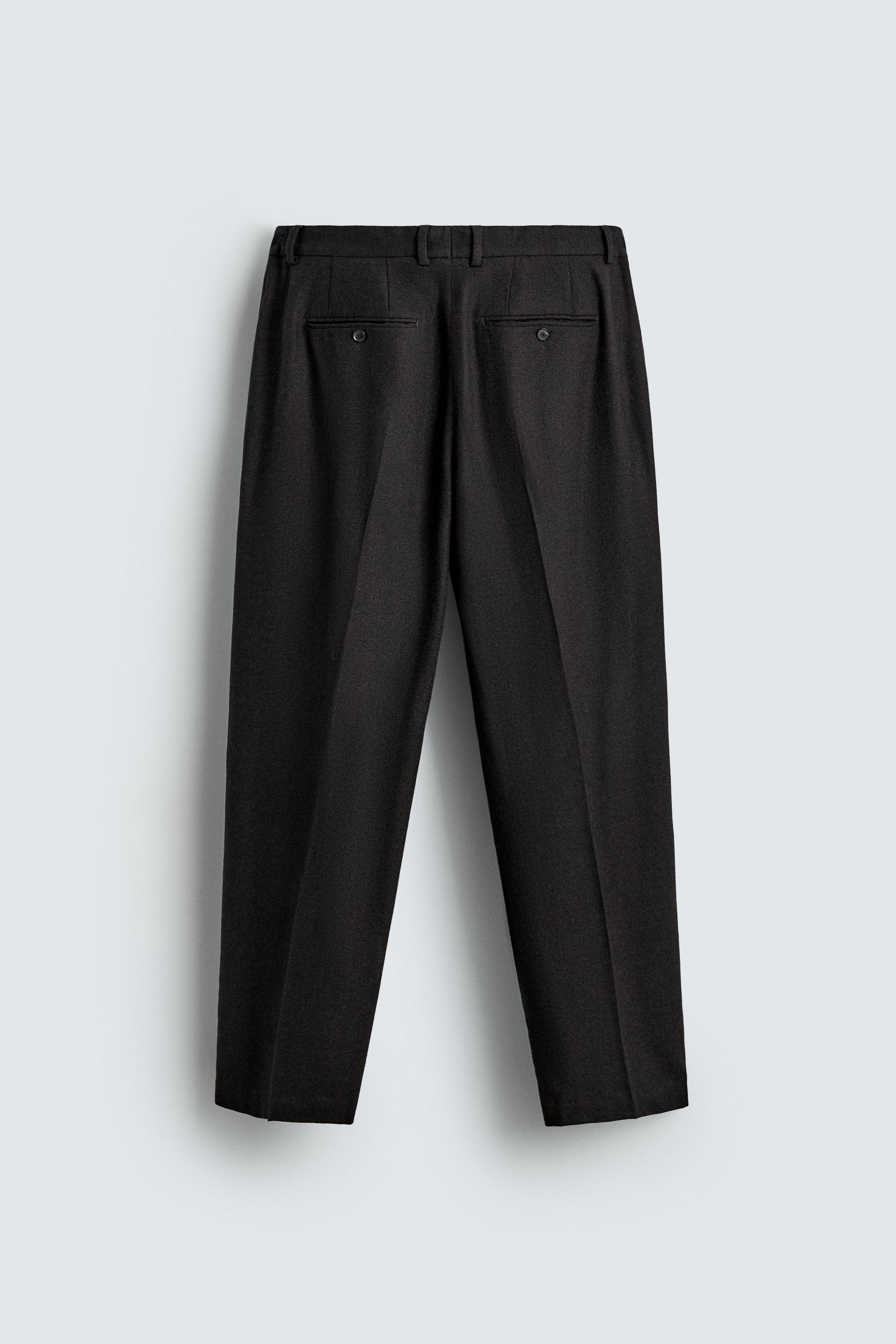 LIMITED EDITION PLEATED WOOL PANTS