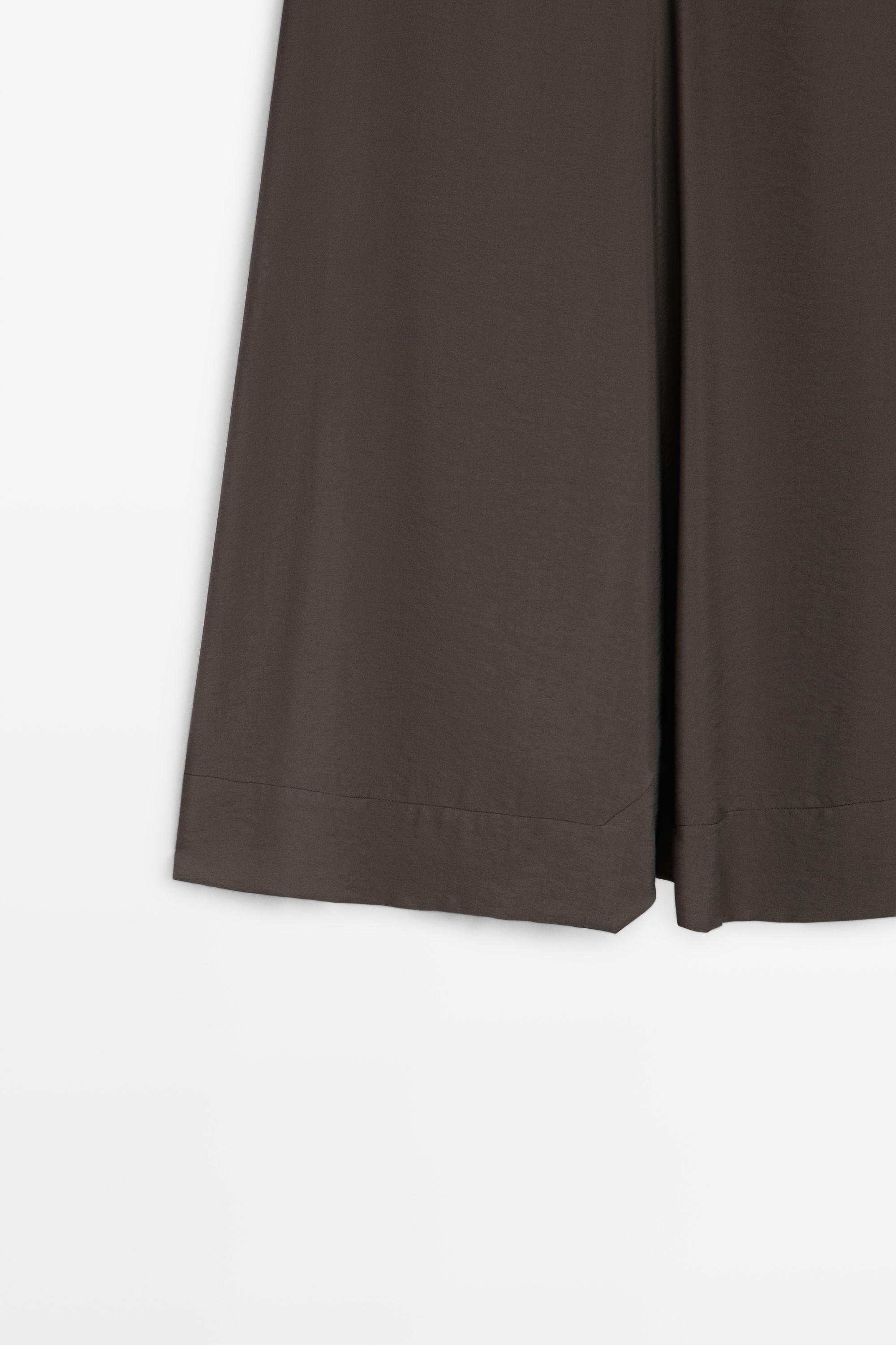 Flowing midi skirt with pleated detail