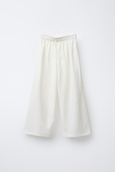 PANTALON FLUIDE À JAMBES LARGES - Écru de Zara - Image 0