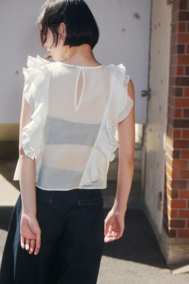 フリル セミシースルーブラウスエクリュZaraのフリル セミシースルーブラウス - エクリュ