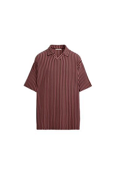 Front view of a short-sleeved, open-necked shirt with vertical stripes in shades of red and black