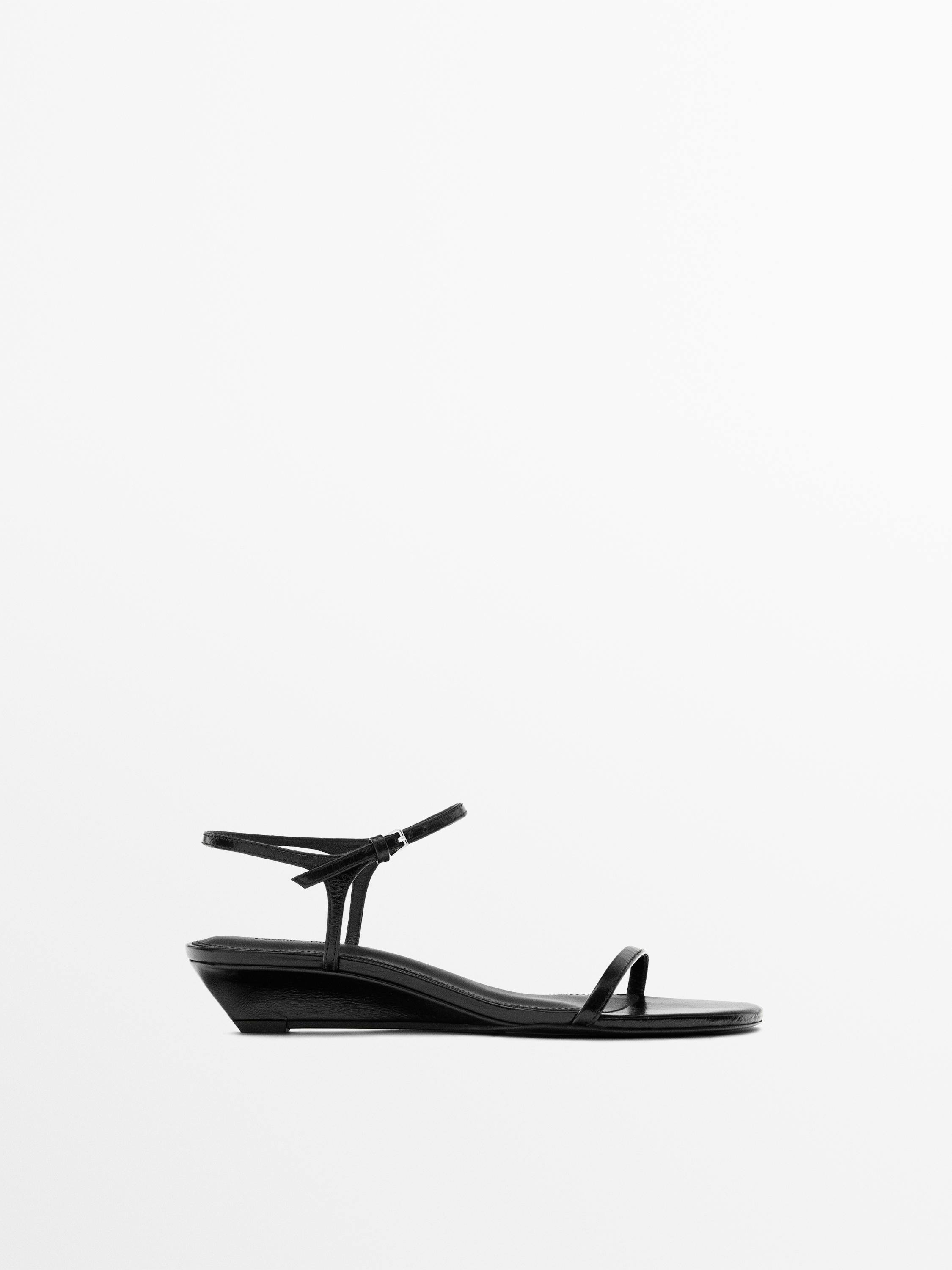 Sandale en cuir à brides compensées