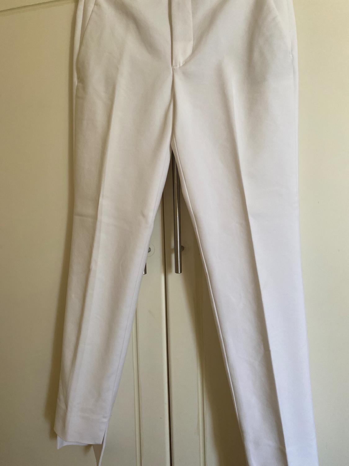 TROUSERS WITH ASYMMETRIC HEMS - Image 4