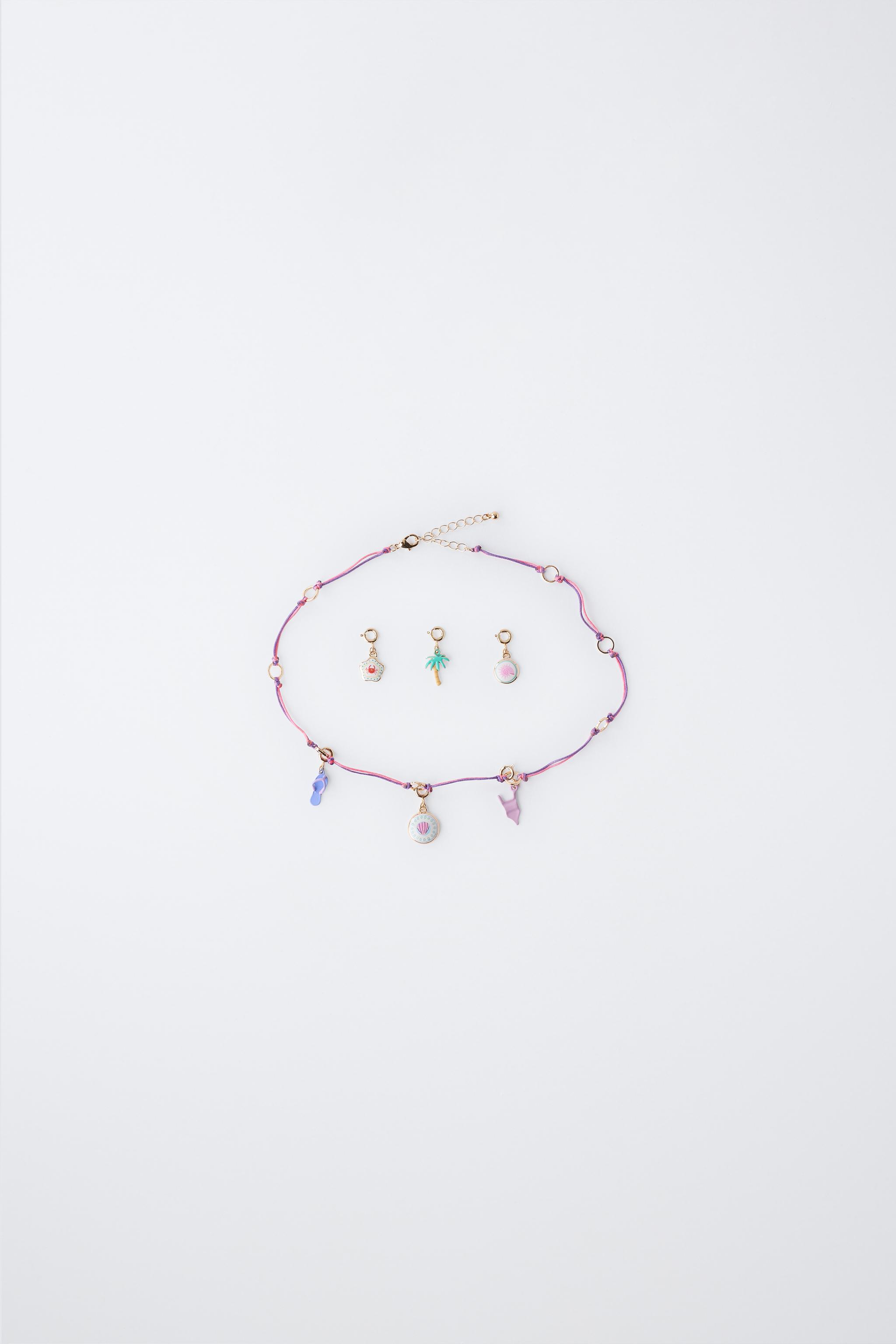INTERCHANGEABLE MULTI-CHARM NECKLACE