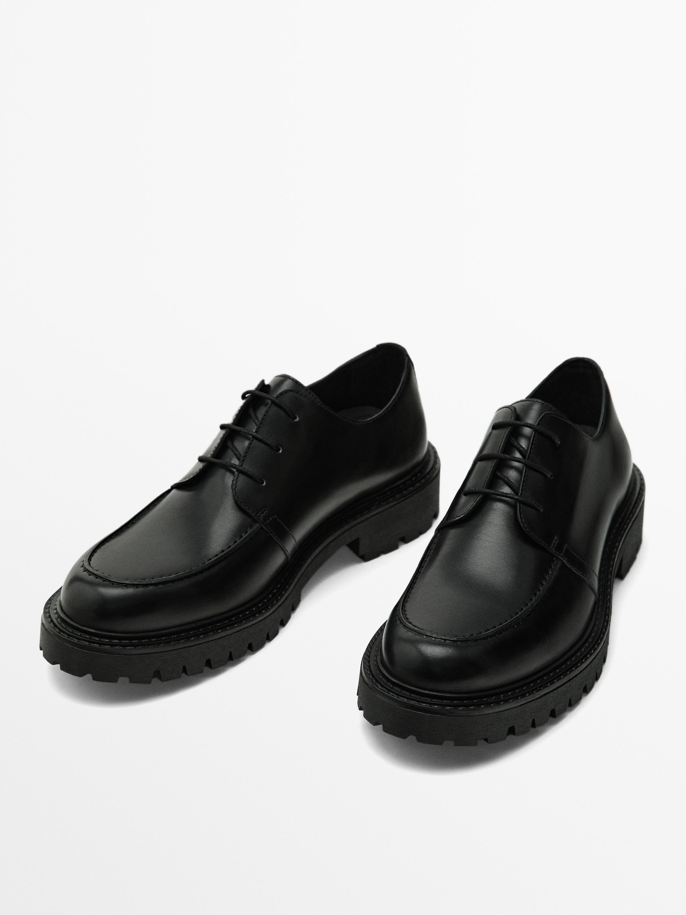 Black moc toe shoes