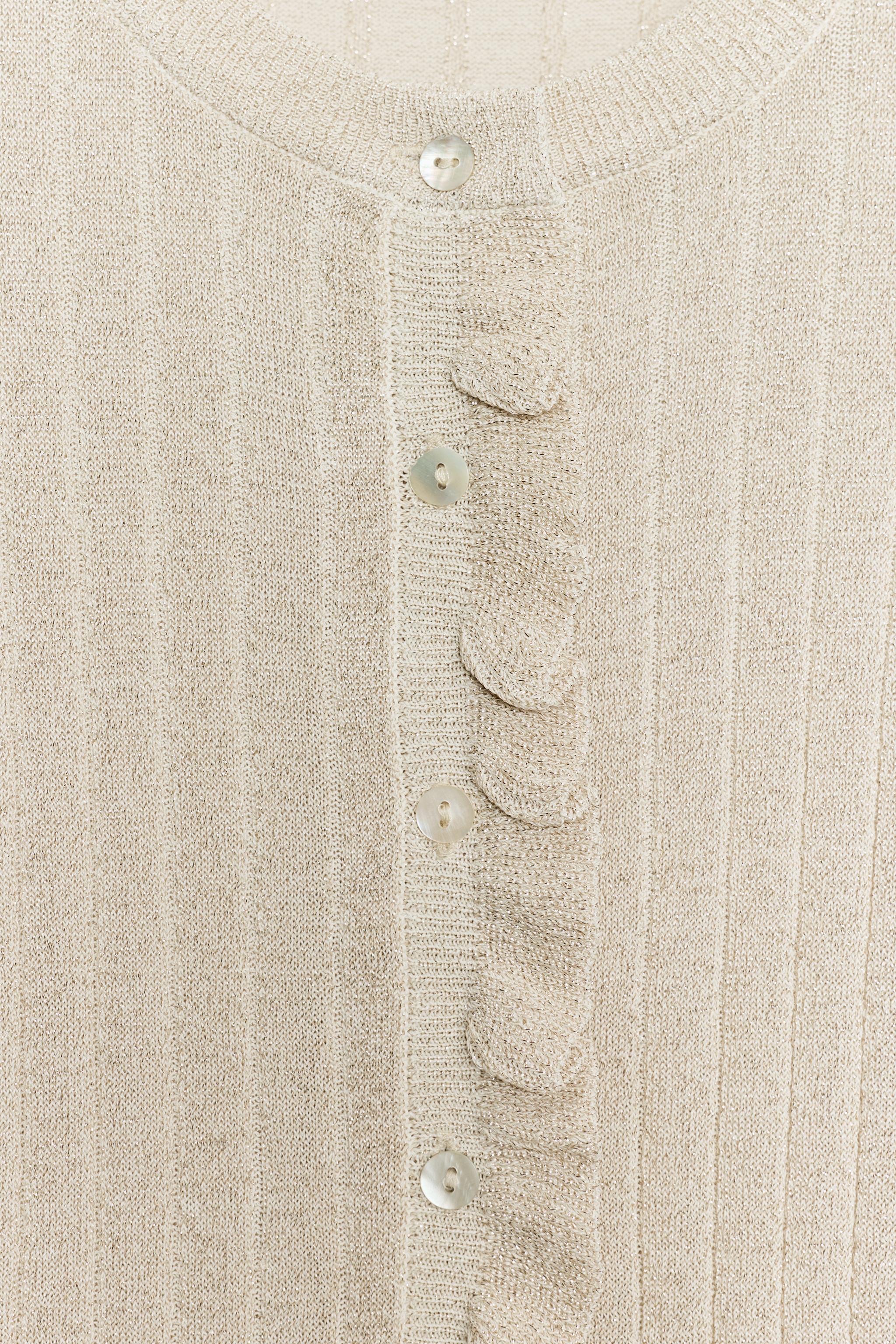 GILET EN MAILLE VOLANTS FIL MÉTALLISÉ