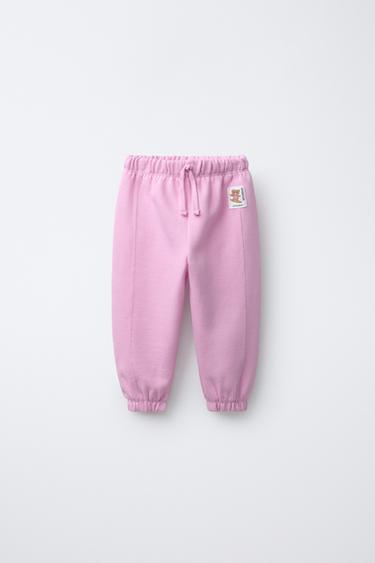 PLUSH JOGGING TROUSERS WITH LABEL APPLIQUÉ - Pink by Zara - Image 0