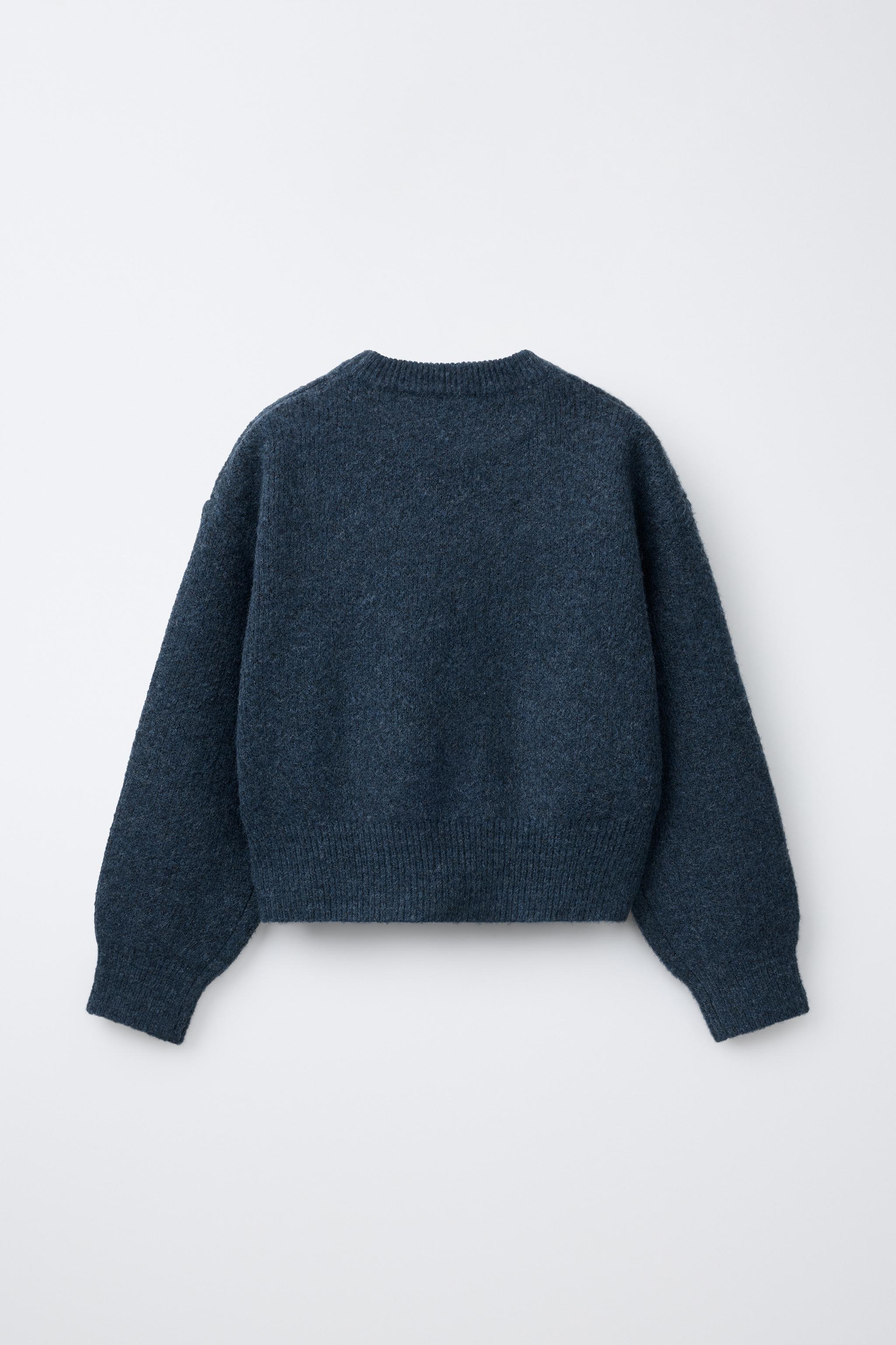 PULL EN MAILLE ÉTOILE CLOUS
