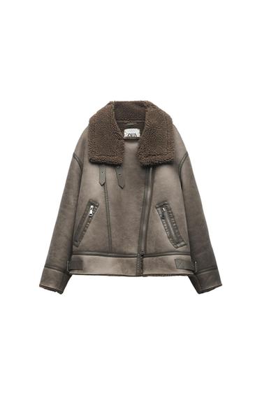 Brown jacket with a wool collar and diagonal zips. Visible label with the text "ZARA" on the inside of the collar.