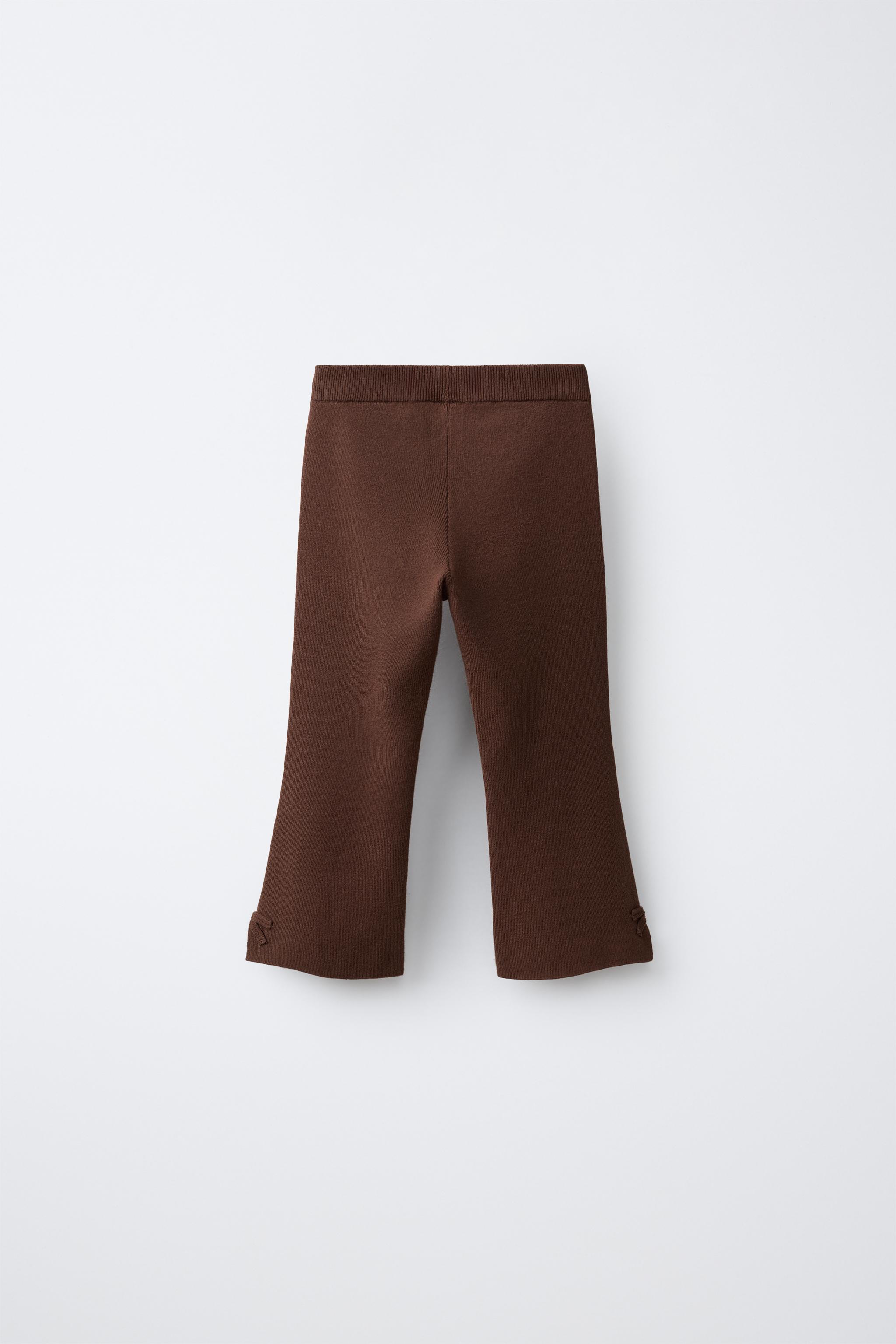 PANTALON EN MAILLE ÉVASÉ À NŒUDS