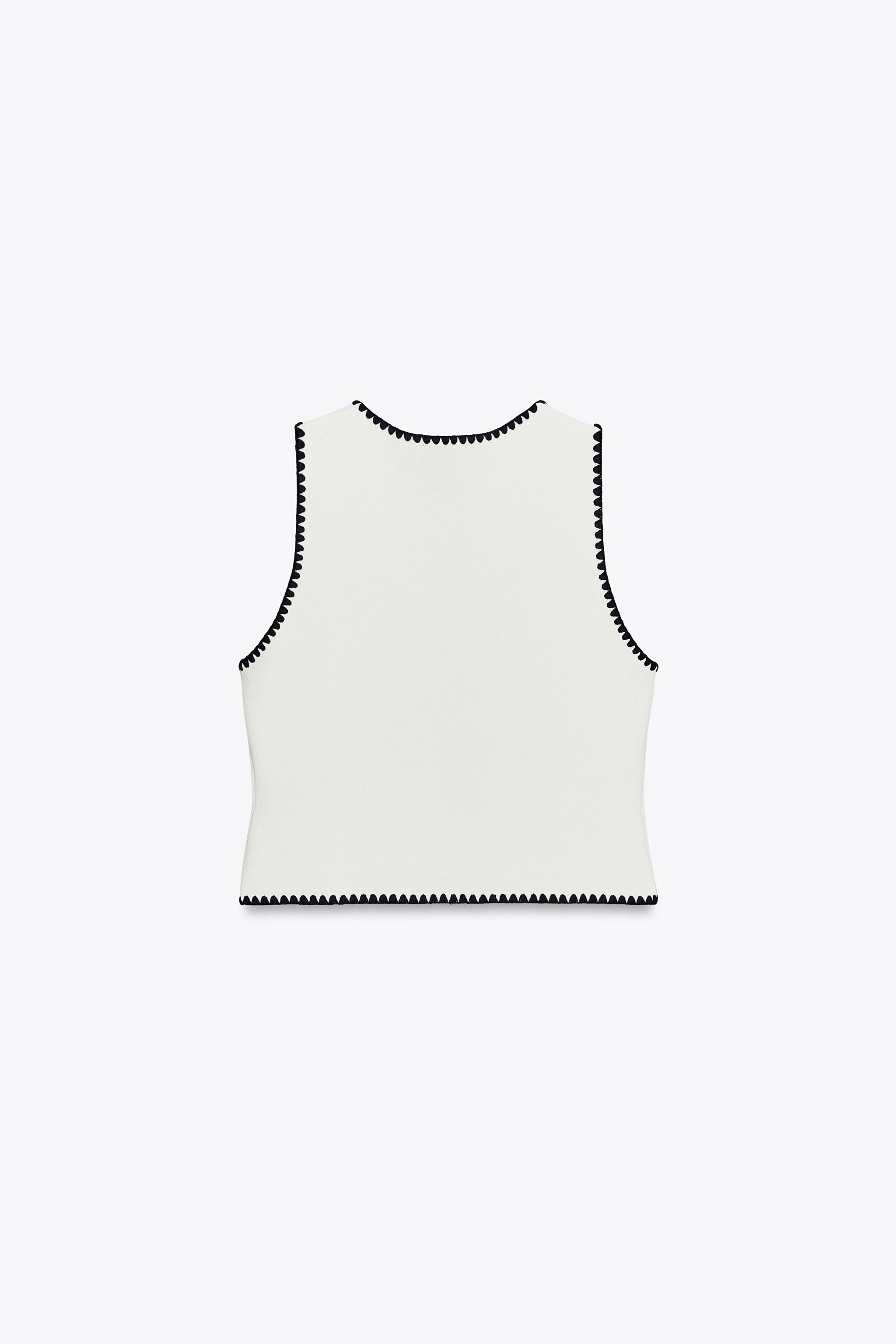 GILET EN MAILLE BRODERIES CONTRASTE