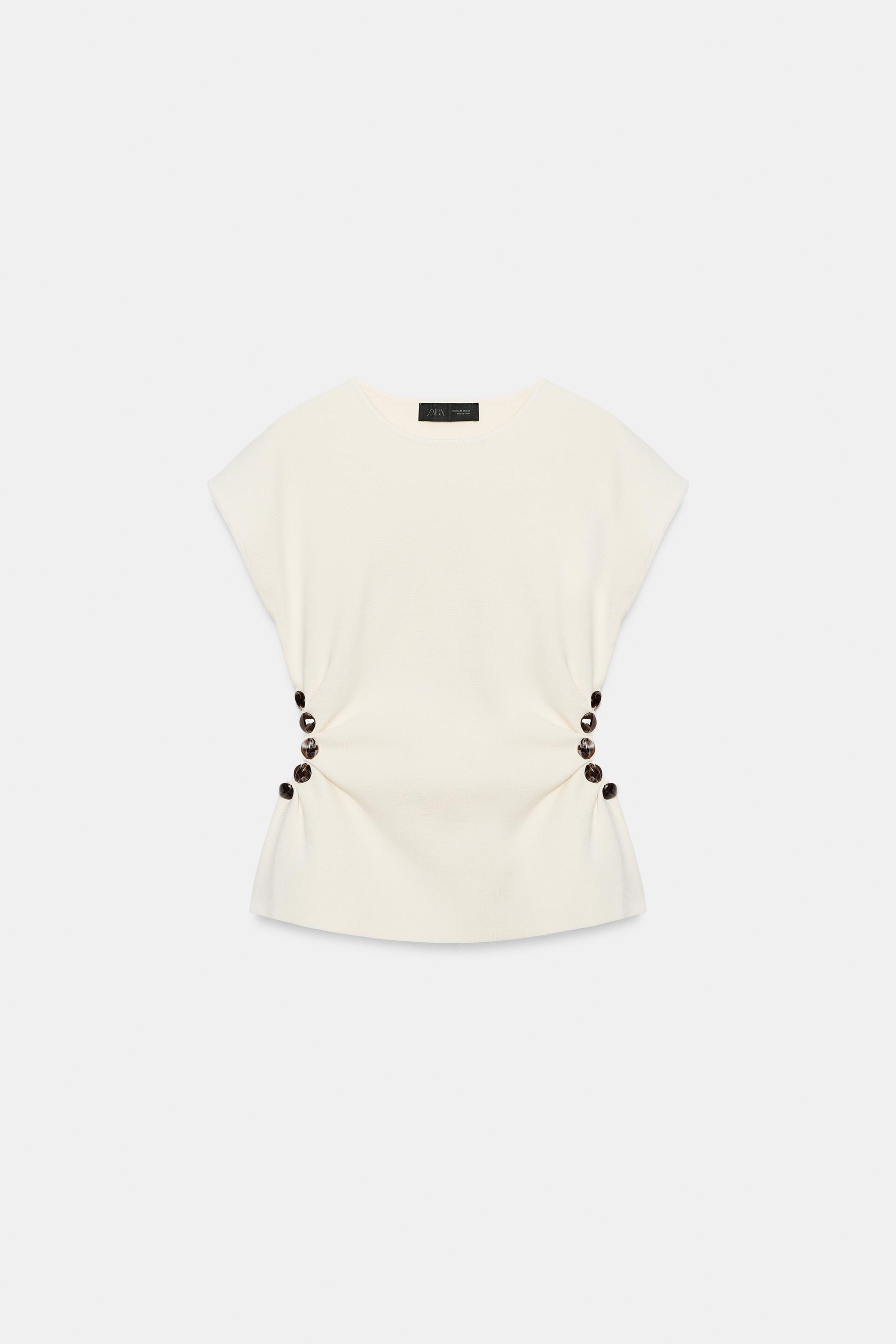 BEADED CUT OUT KNIT TOP
