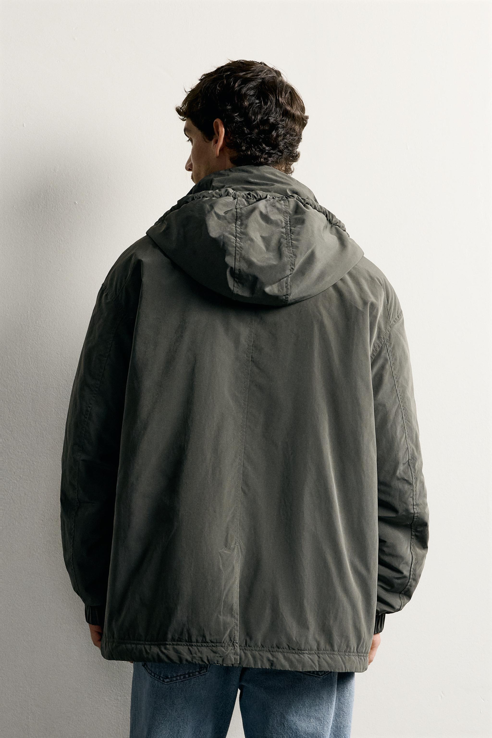 BLOUSON TECHNIQUE À CAPUCHE DÉPERLANT