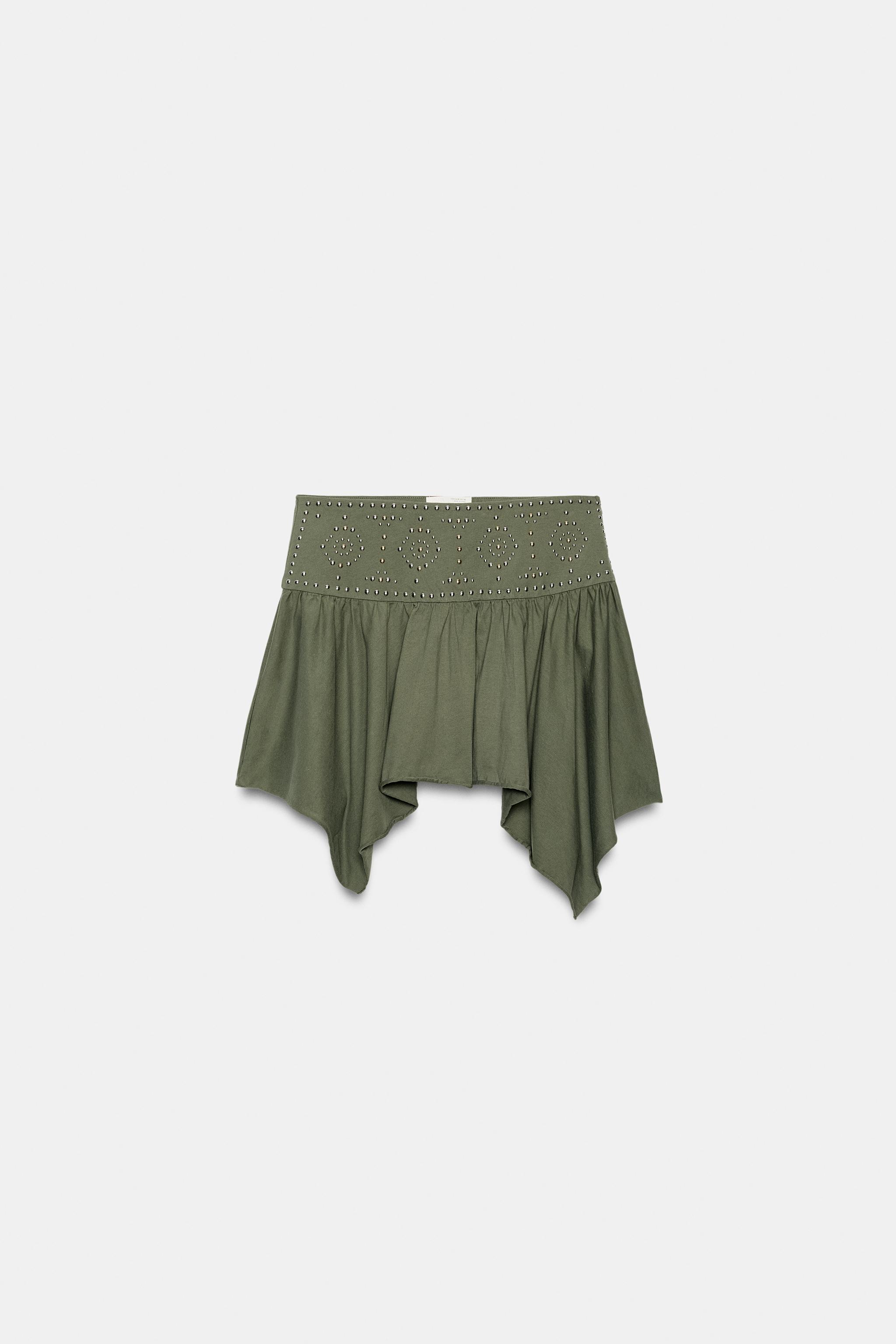JUPE ASYMÉTRIQUE À CLOUS