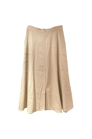 Beige midi skirt with an A-line cut, panels, visible seams, and a front slit on a white background.