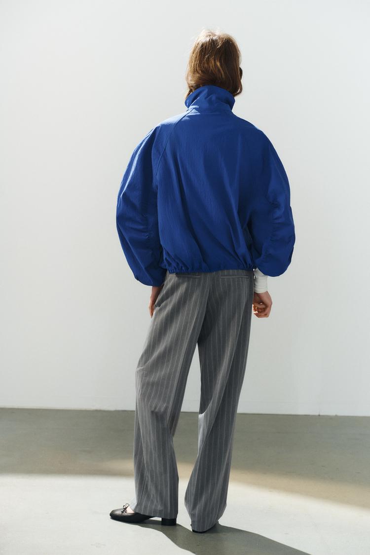 Chaqueta de tela técnica con botones 6