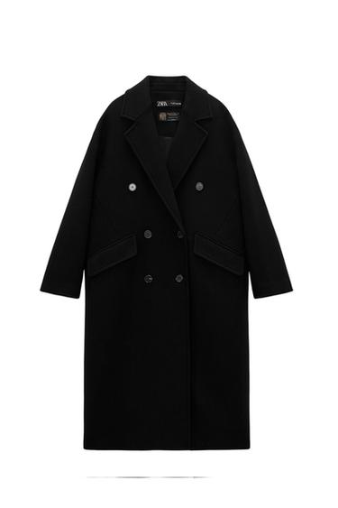 Front view of a long black double-breasted coat with side flap pockets.