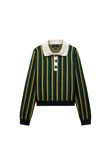 Front view of a green and yellow vertically striped jumper with a white collar and large buttons.