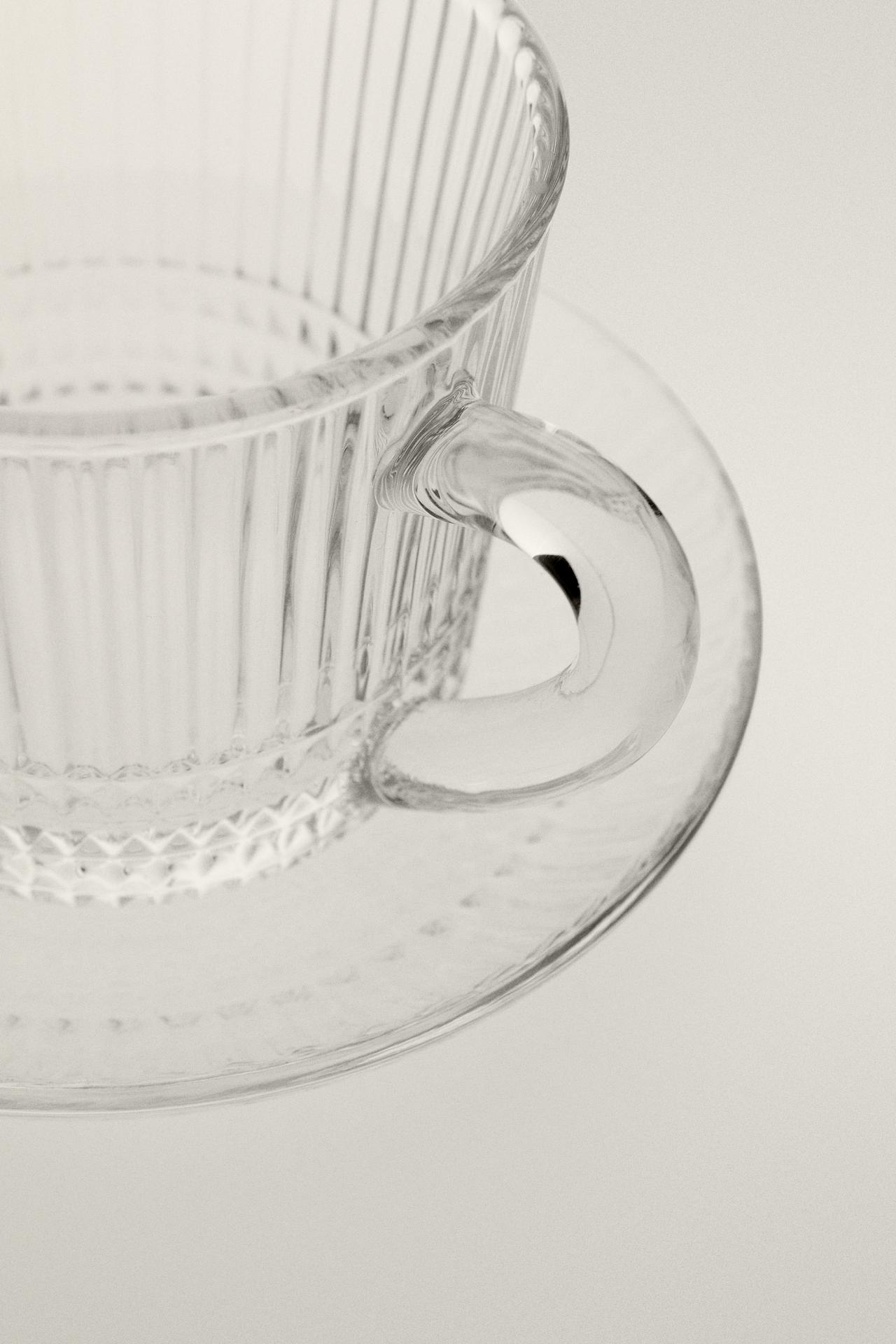 GLASS COFFEE CUP WITH SAUCER AND RAISED GEOMETRIC DESIGN. — Transparent