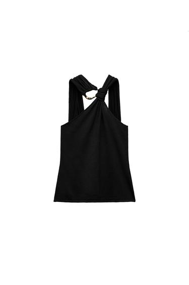 Front view of a black top with knot and ring detail at the neckline.