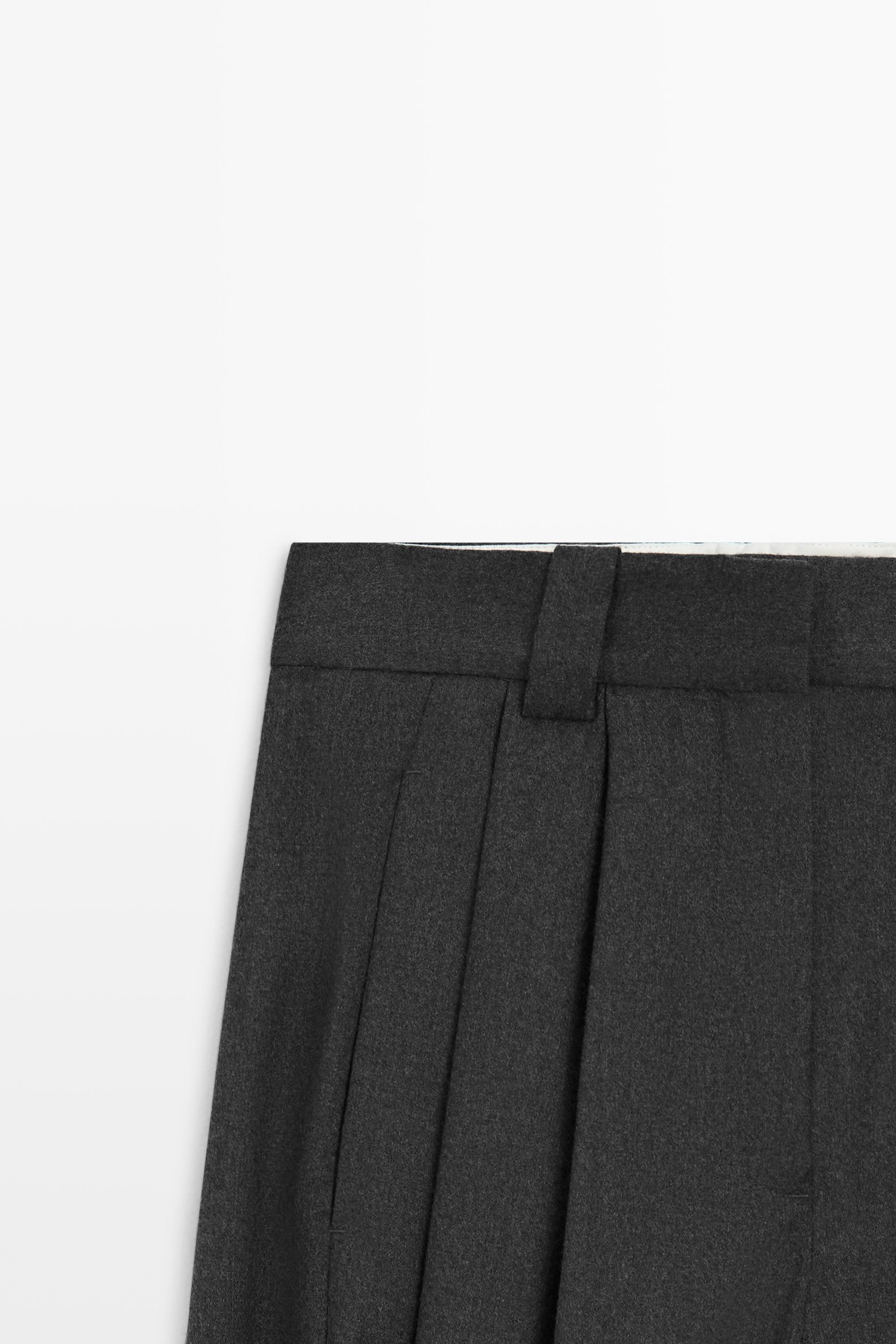 Pantalon flanelle à plis et détail bas