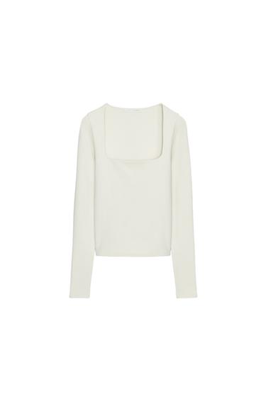 Front view of a fitted raw T-shirt with a square neckline and long sleeves.