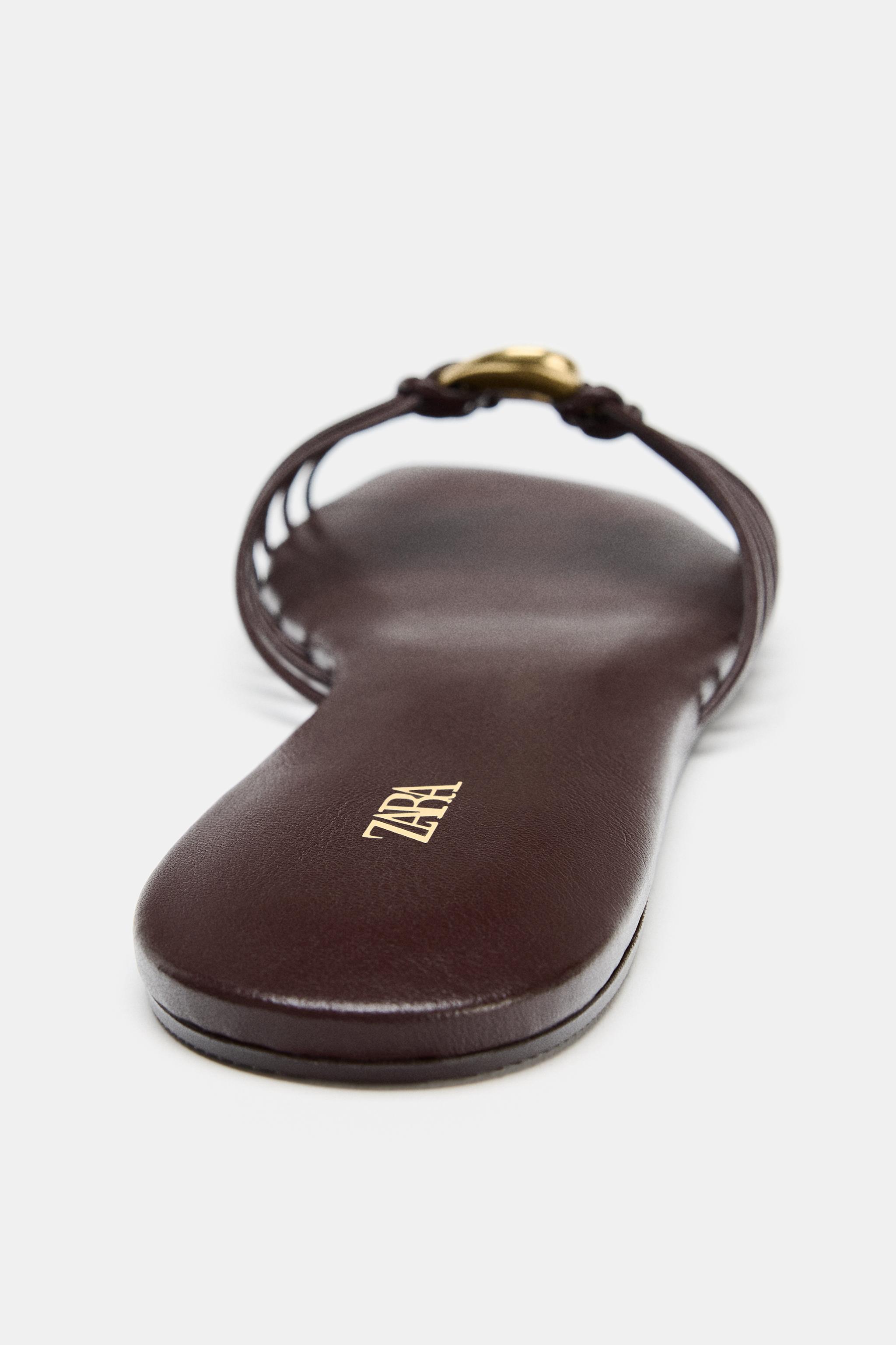 FLAT SANDALS WITH METALLIC TRIM