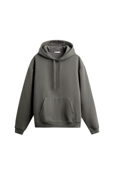 Front view of a grey hoodie with a hood and front pocket.