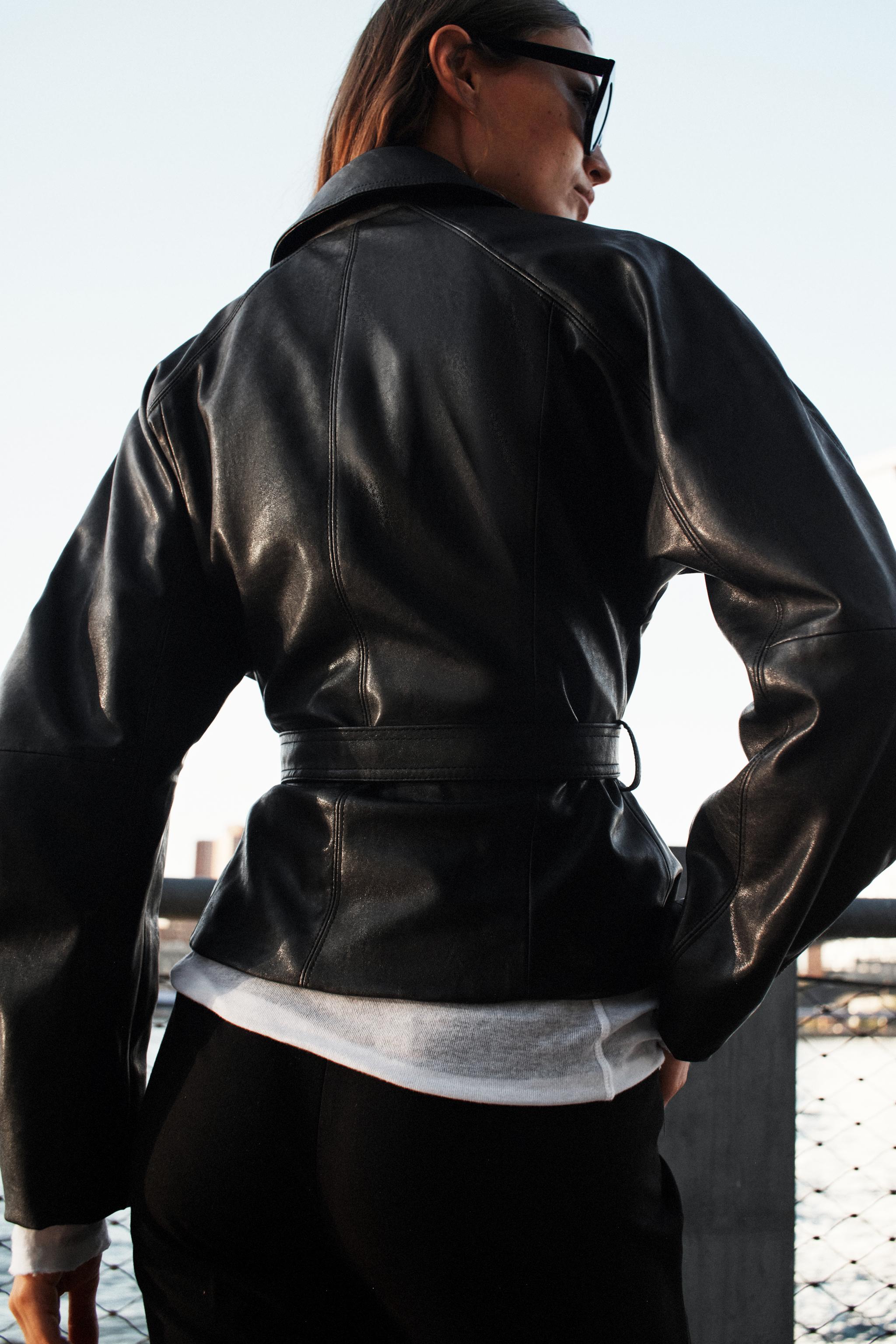 LEATHER-EFFECT BELTED JACKET