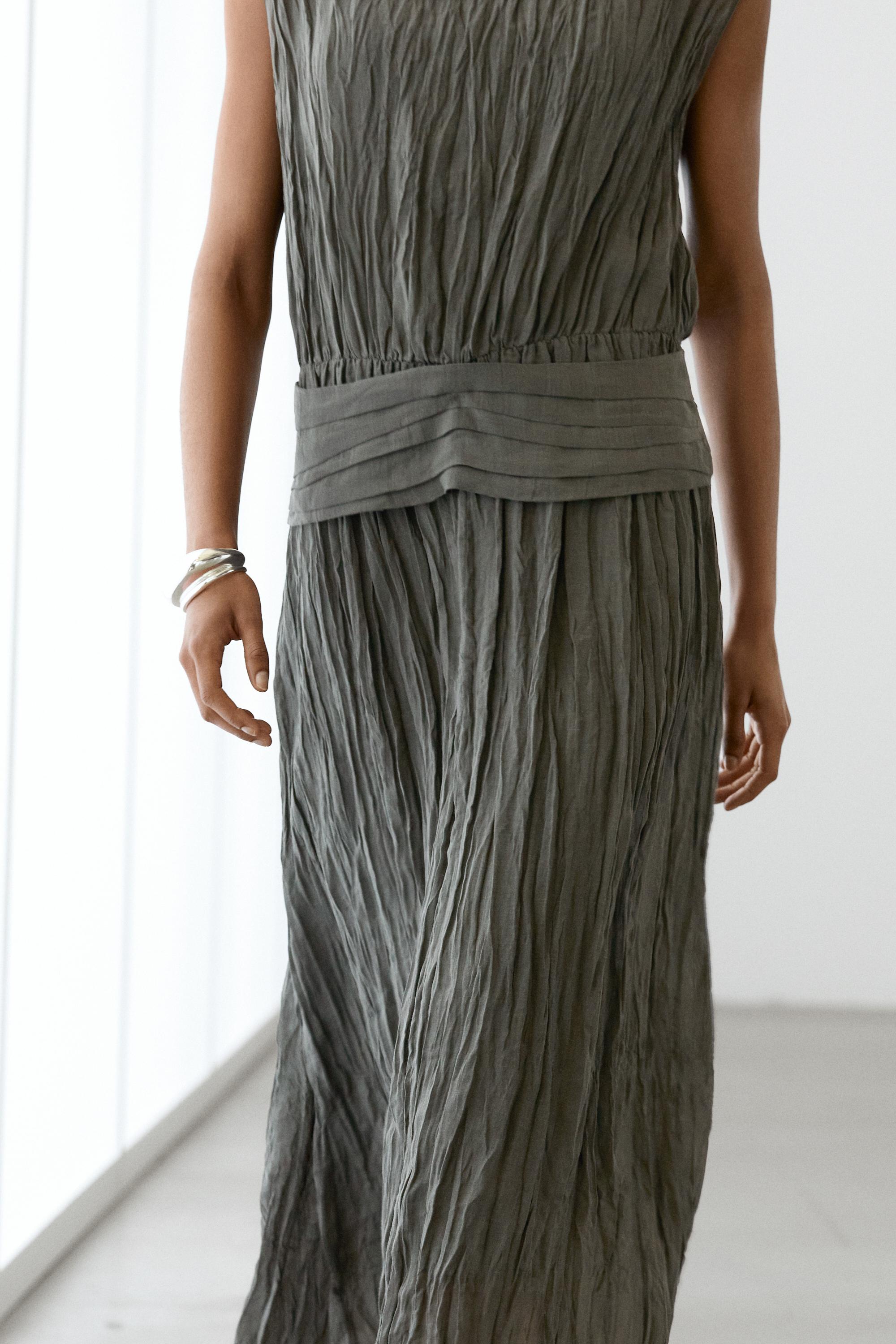 Textured flowing fabric dress with sash belt